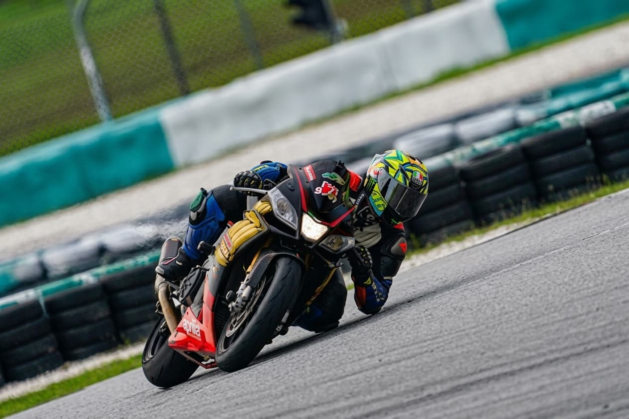 KRS rider leaned over through a corner on track
